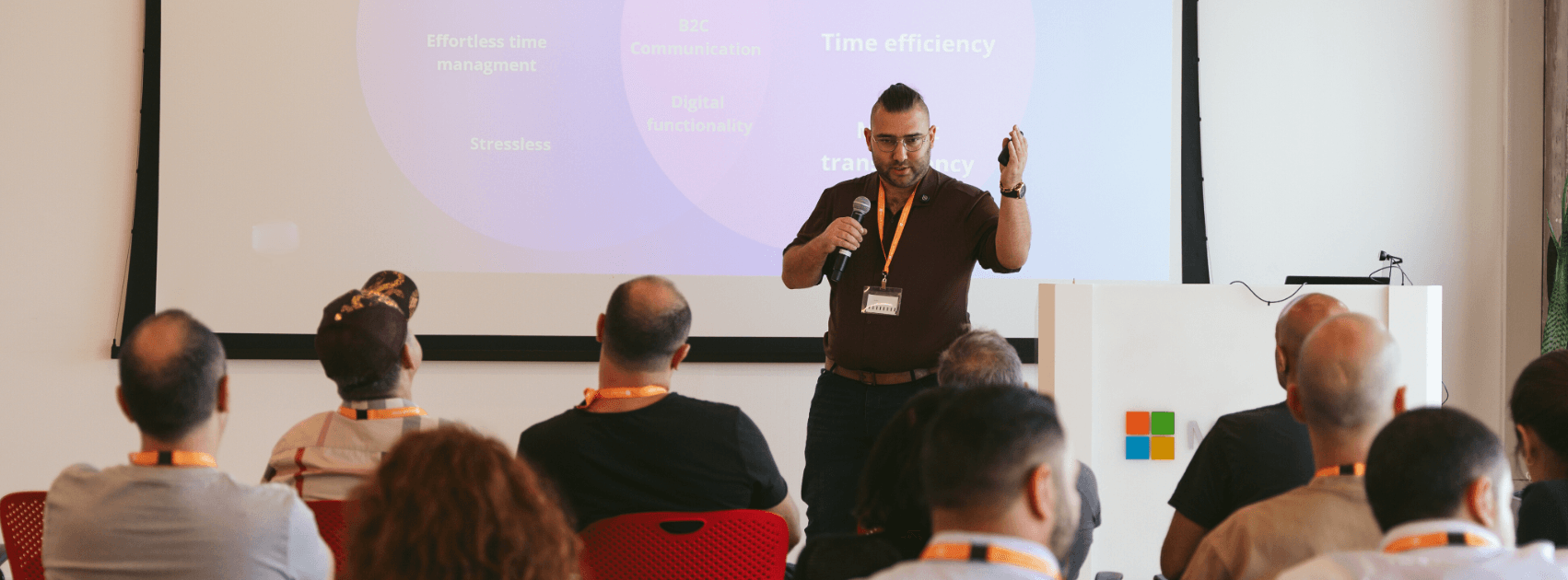 Alexander Slutsker delivering a business lecture - Mobius Business Solutions